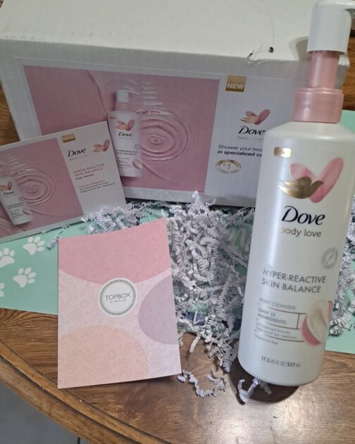 Top Box Cirlce note care with Dove body love product box. Dove body love cleanser with box and info cards.