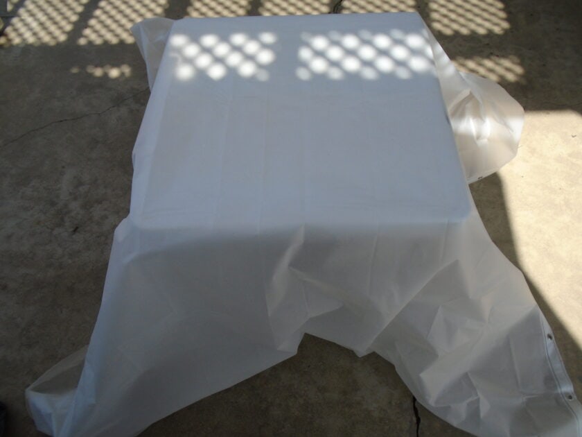 a shower curtain liner draped over a table.