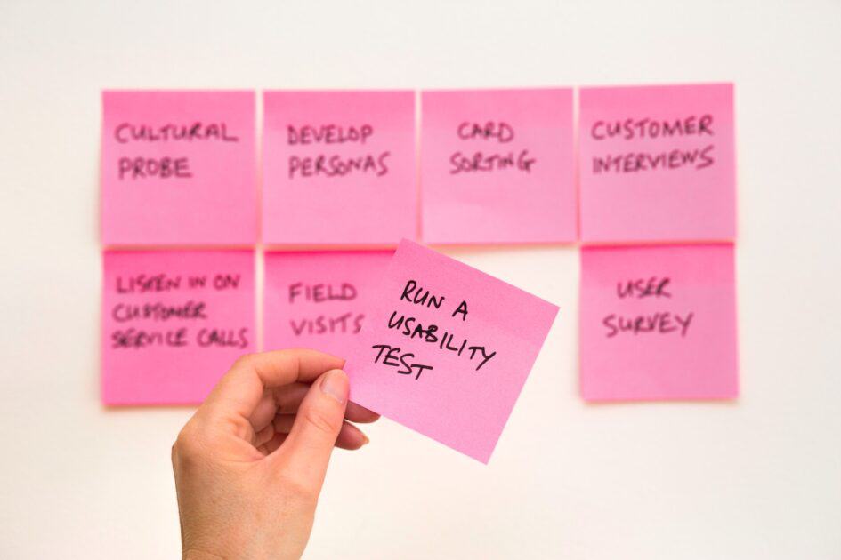 person holding pink sticky note photo by David Travis image source unsplash