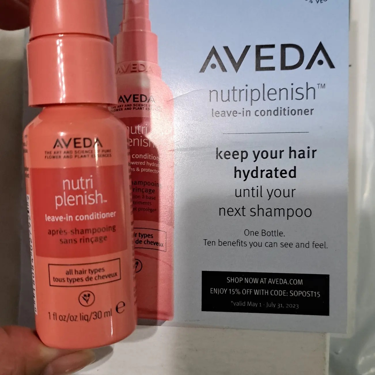 Aveda nutriplenish leave in conditioner spray. travel size bottle. Info card included in image.