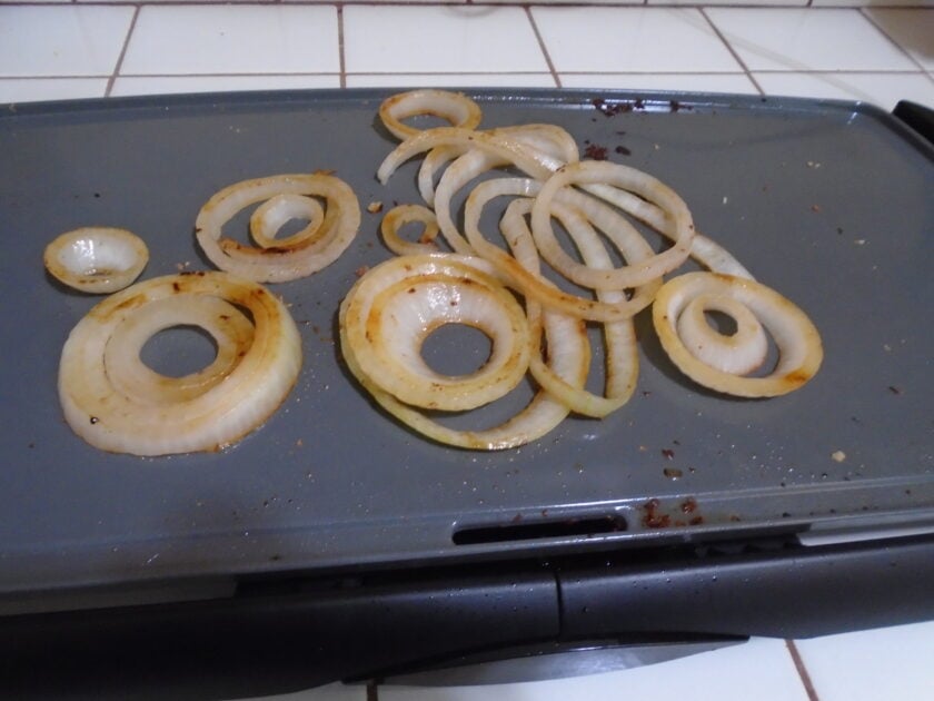 cooked onions on the griddle.