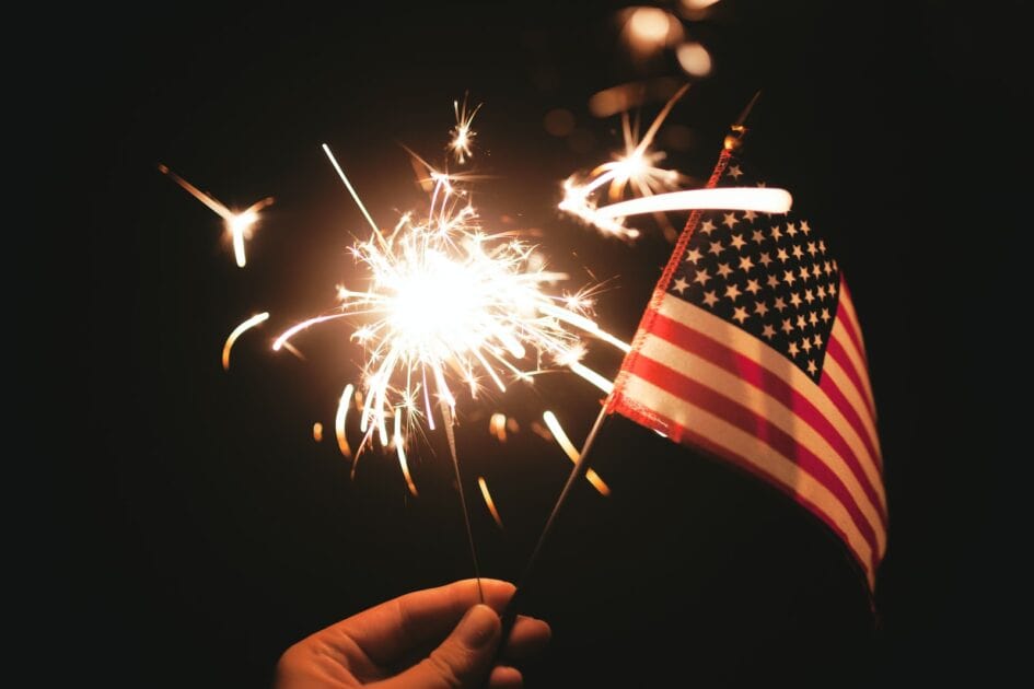 time lapse photography of sparkler and U.S.A flag Photo by Stephanie McCabe. photo source unsplash.