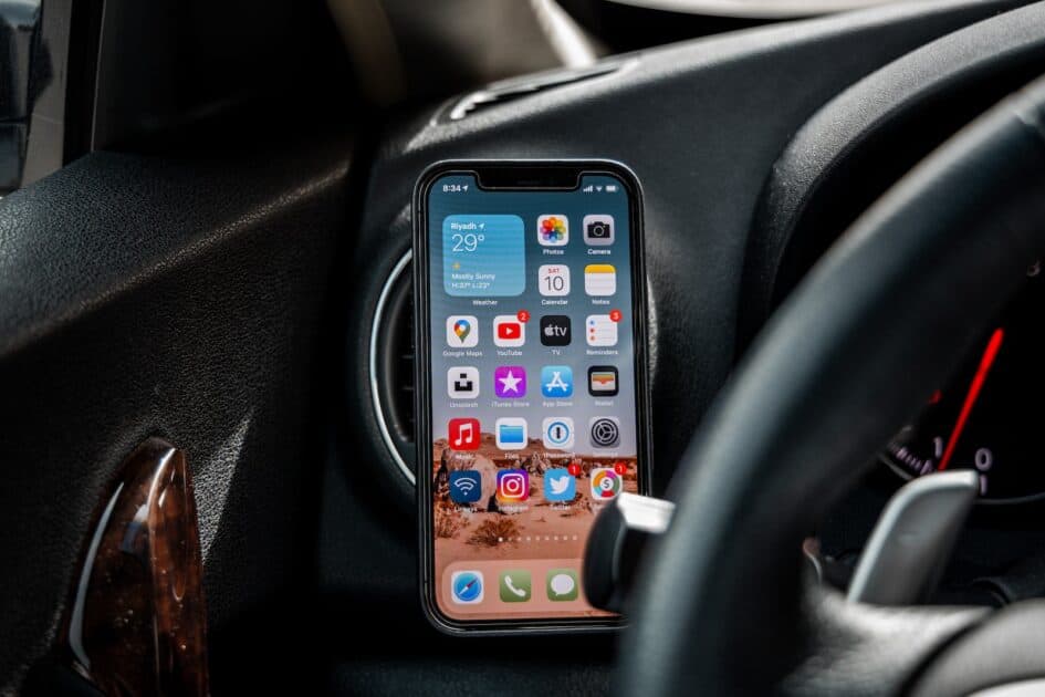 black iphone 4 on car dashboard. Photo by by Omar Al-Ghosson. photo source unsplash.