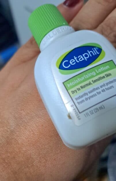 Cetaphil travel size bottle on the top of my (v's) hand. lotion absorbed into my hand.