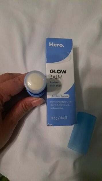 Hero Cosmetics Glow Balm in box. with Glow balm stick top removed showing plastic protector.