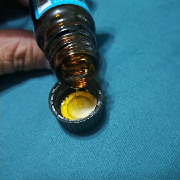 Moroccanoil sample bottle, golden oil.