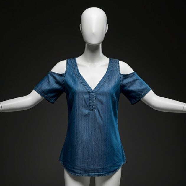 Mannequin wearing a cold shoulder top. Image crated using Image FX AI.