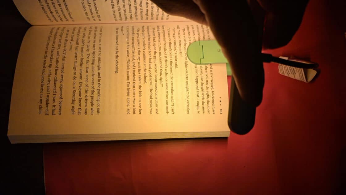 Gritin Rechargeable Book Light clipped to book warm light.