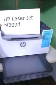 HP Laser Jet M209 d printer with product name page.