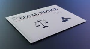 Legal notice mailer. Image created with ImageFX AI. an envelope with the words Legal Notice and legal scales symbol and a gavel.