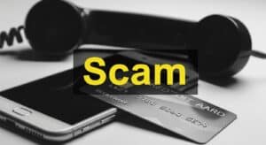 Credit Carde phone scam image. a credit card, smartphone and a landline phone headset with the text scam. Image created using Whisk AI by Google.